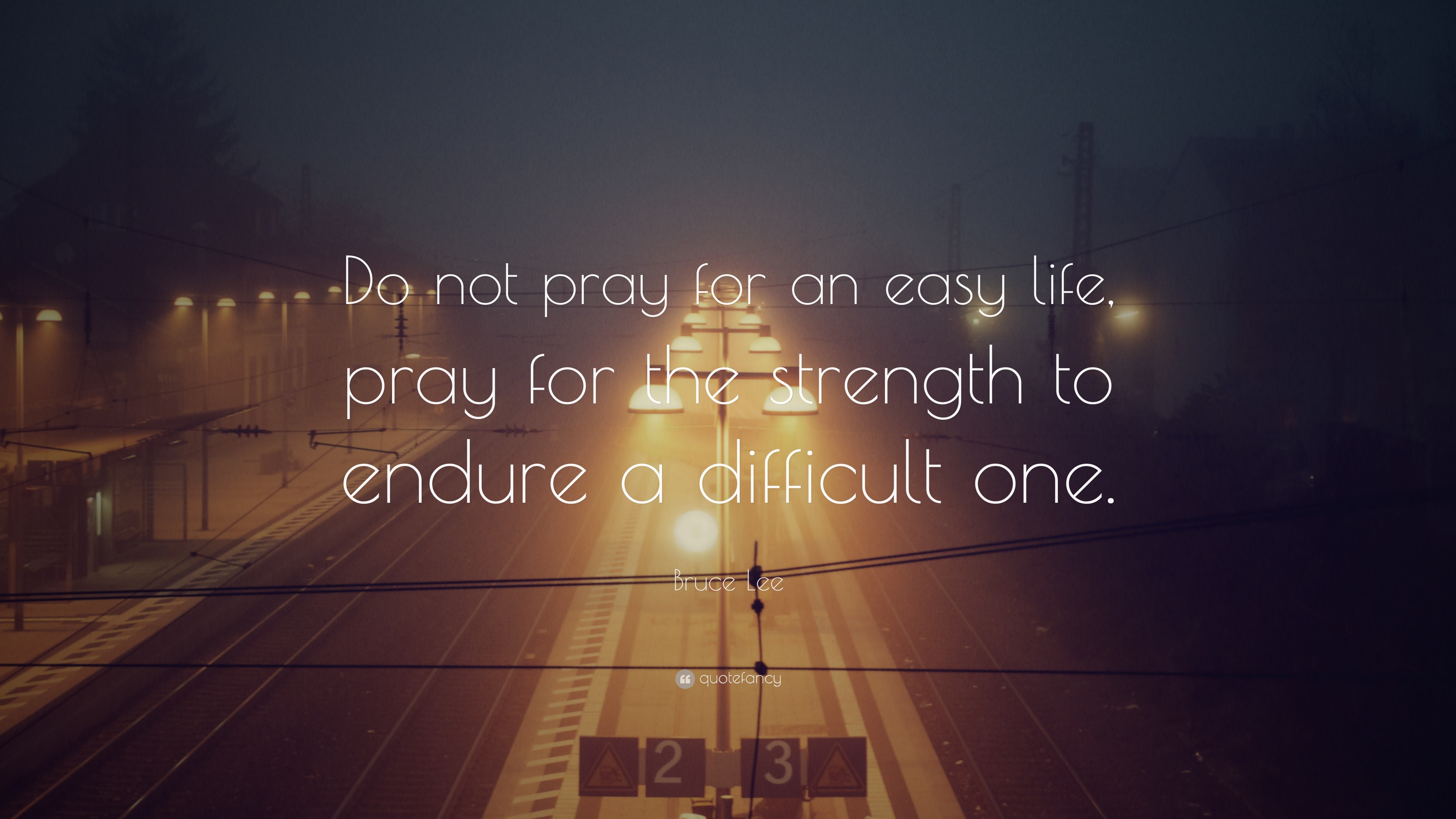 Bruce Lee Quote: “Do not pray for an easy life, pray for the strength