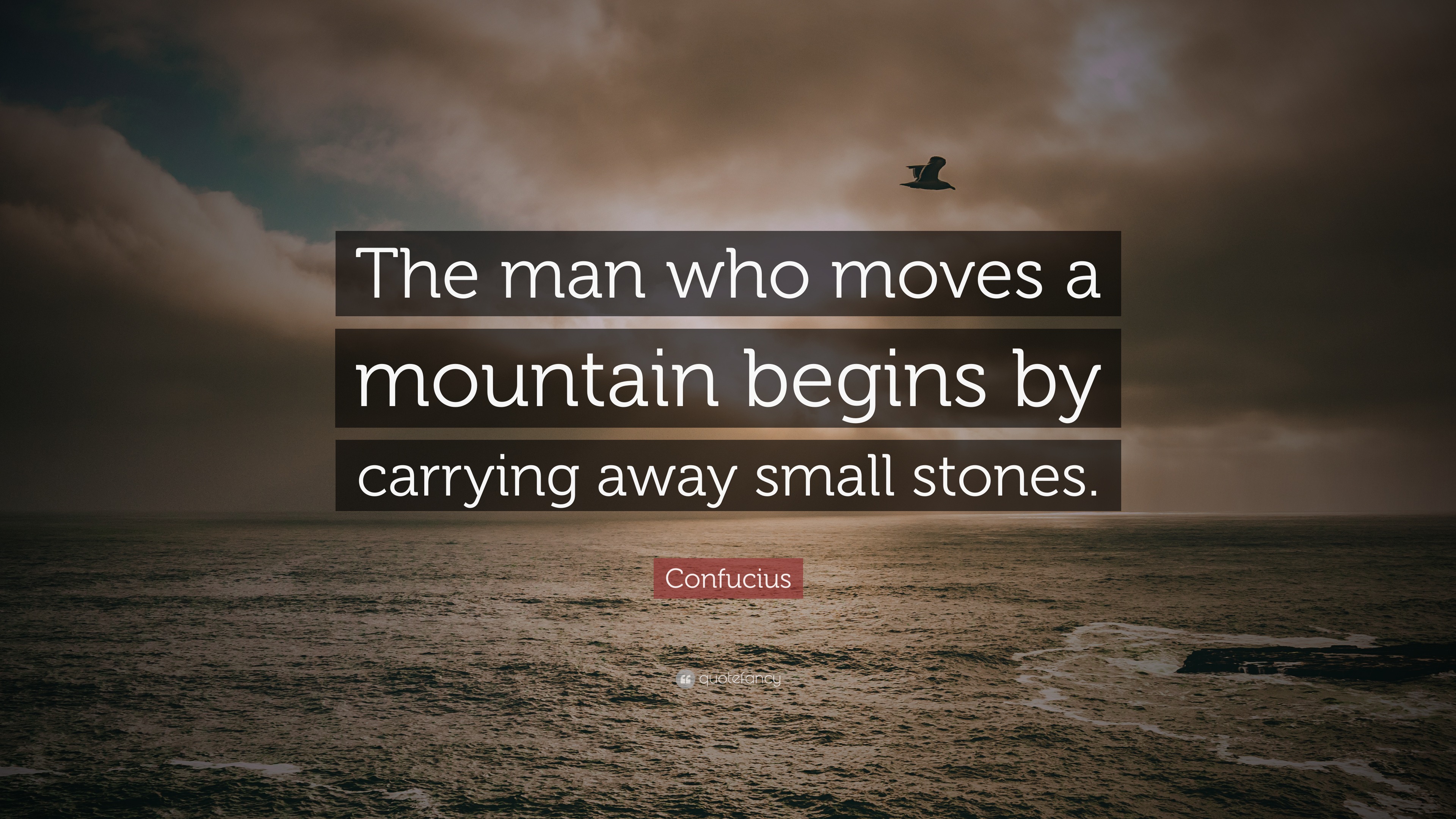 Confucius Quote: “The man who moves a mountain begins by carrying away ...