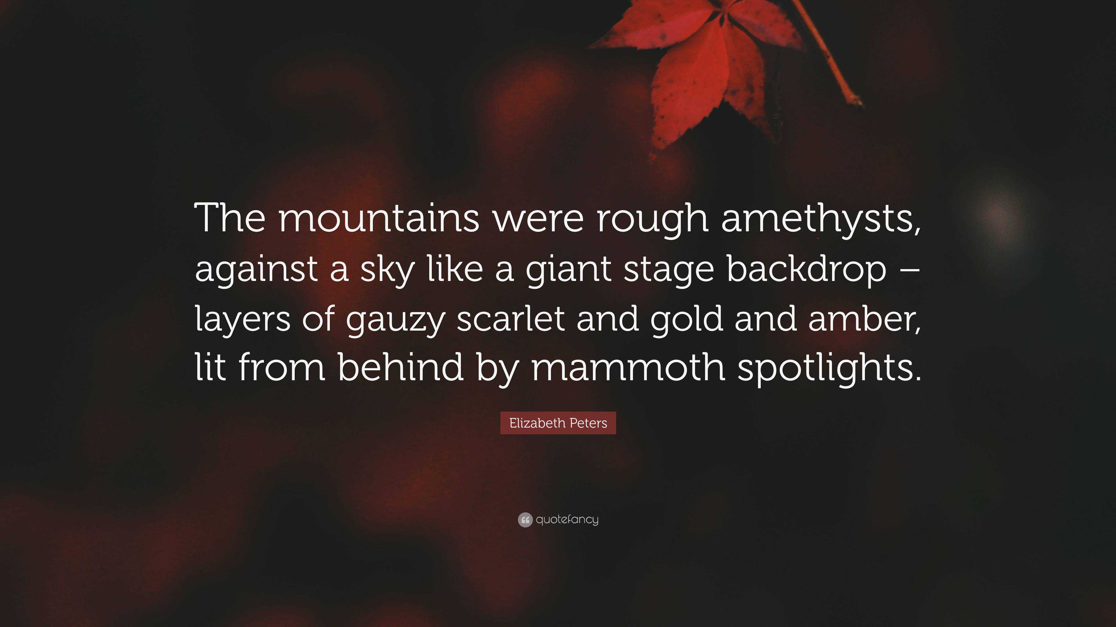 Elizabeth Peters Quote: “The mountains were rough amethysts, against a sky  like a giant stage backdrop – layers of gauzy scarlet and gold and amb...”