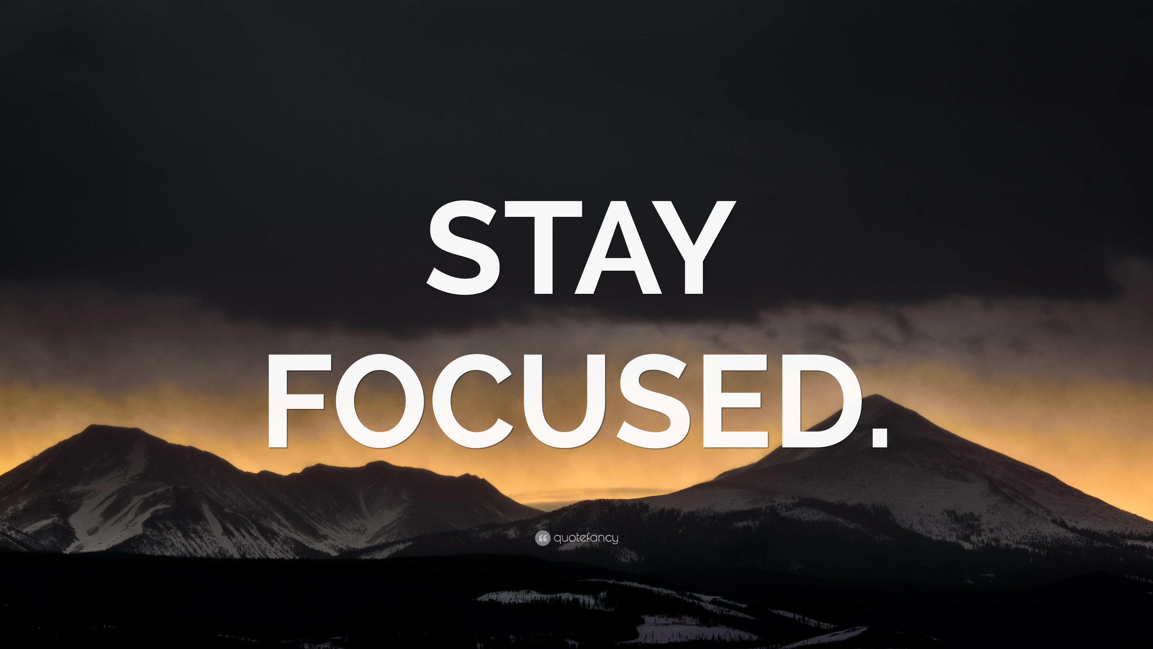 “STAY FOCUSED.” Wallpaper by QuoteFancy