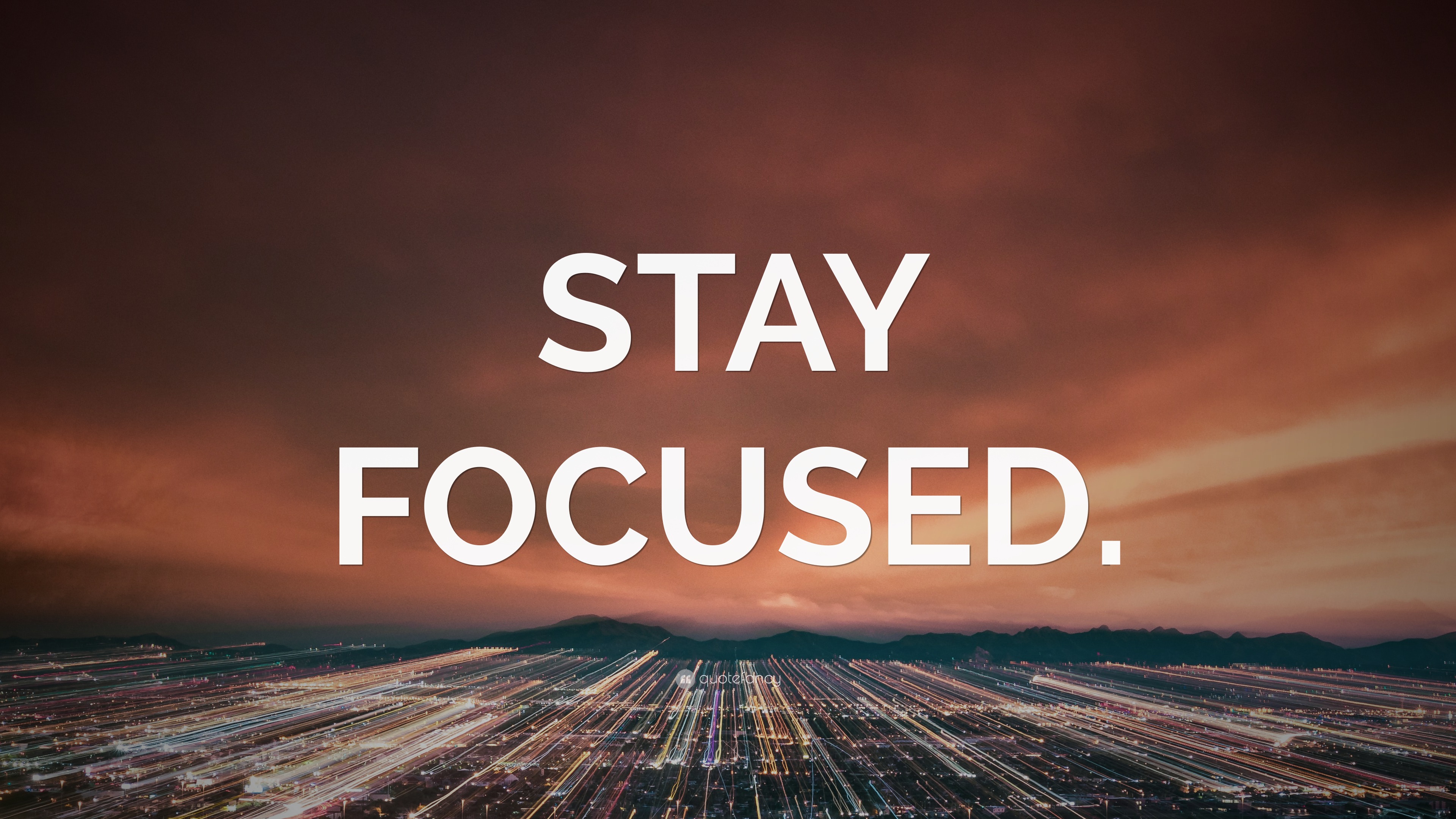 “STAY FOCUSED.” Wallpaper by QuoteFancy