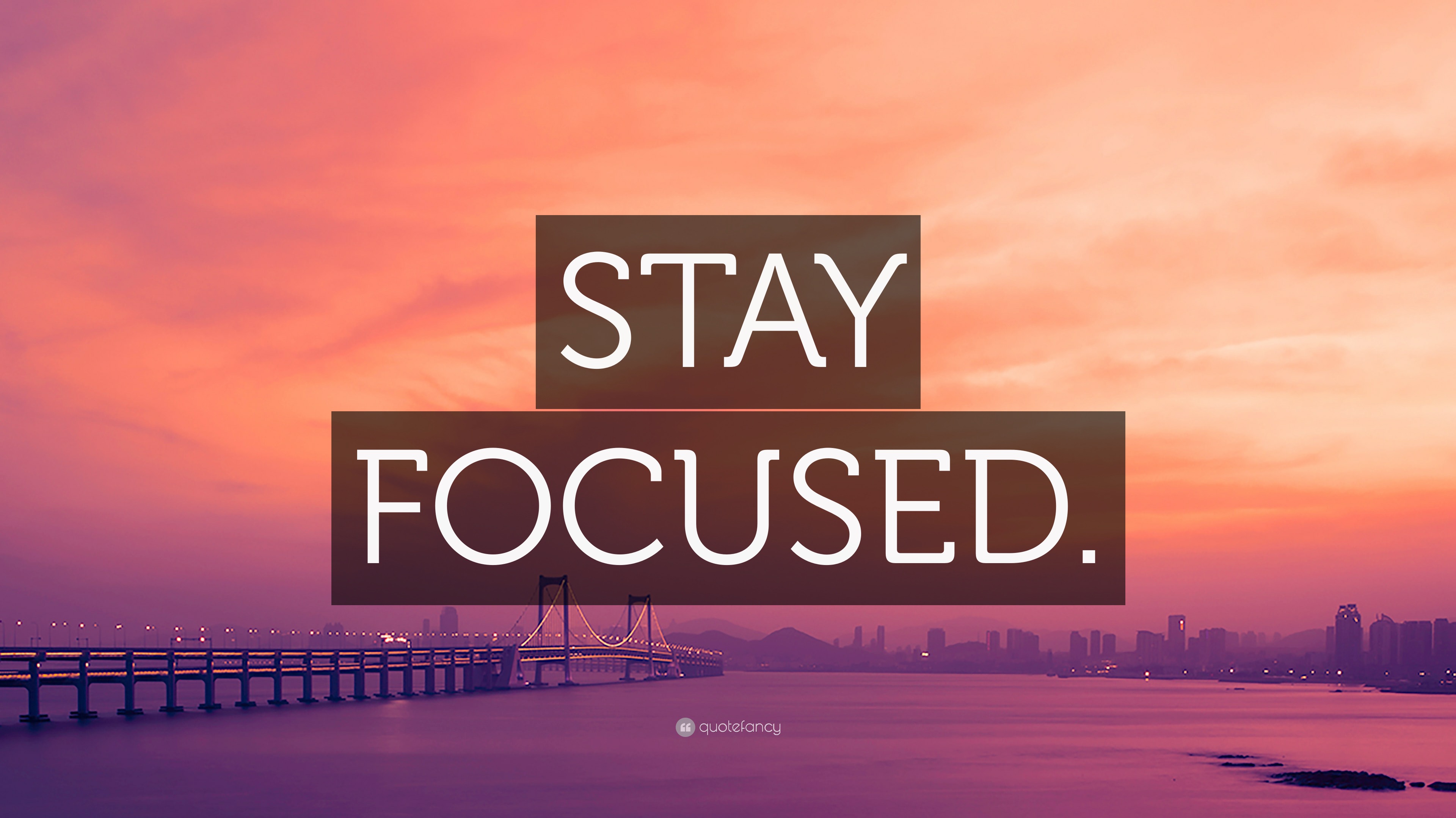 “STAY FOCUSED.” Wallpaper by QuoteFancy