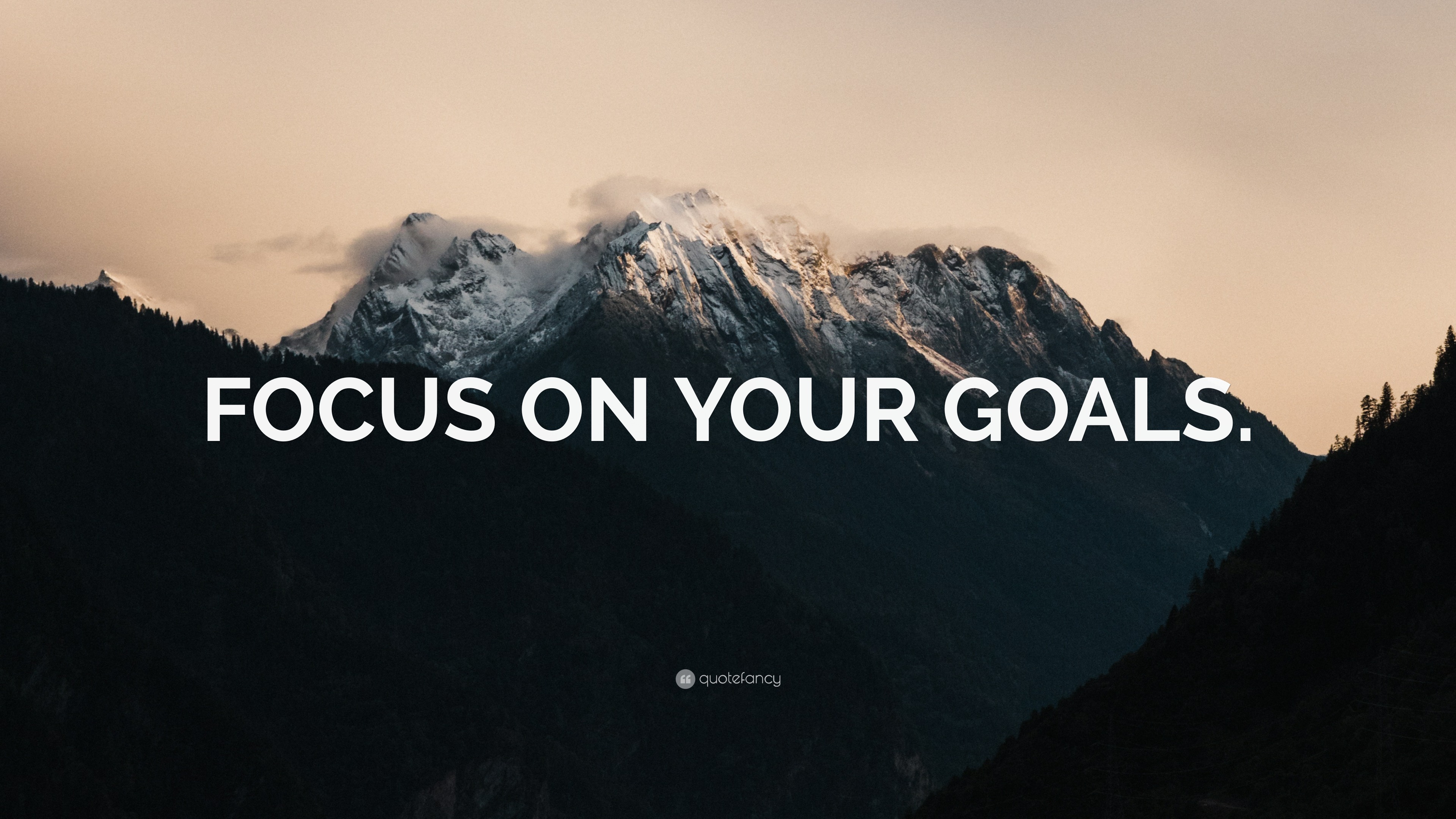 FOCUS ON YOUR GOALS.” Wallpaper by QuoteFancy