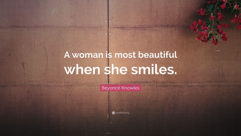 Beyoncé Knowles Quote: “A woman is most beautiful when she smiles.”