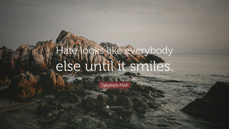 Tahereh Mafi Quote: “Hate looks like everybody else until it smiles.”