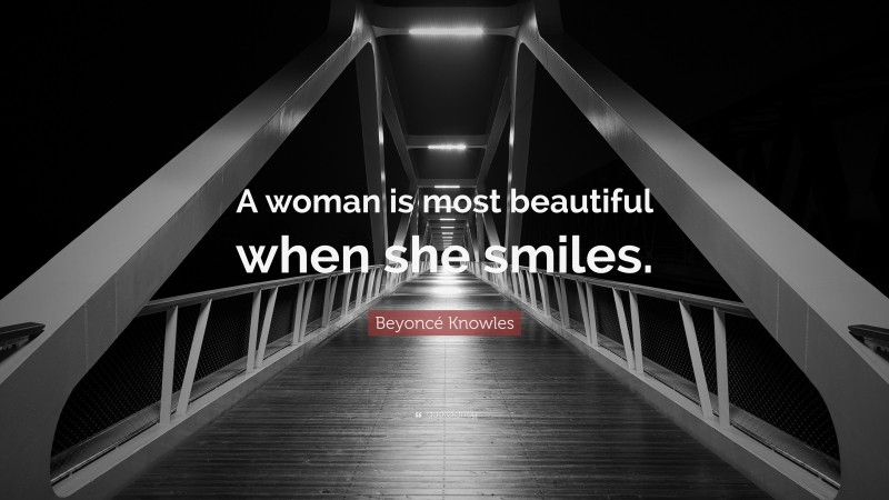 Beyoncé Knowles Quote: “A woman is most beautiful when she smiles.”